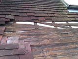 Exposed timberwork shows failed featheredge boarding