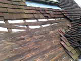 Exposed timberwork shows failed featheredge boarding