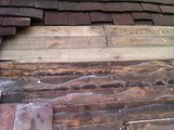 Featheredge boarding re-fixed where possible and renewed where not.