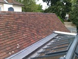 Re-roof of garage in small clay tiles